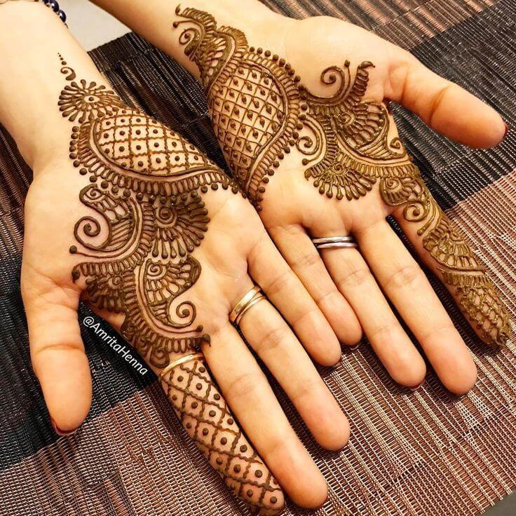 Elegant Arabic palm mehndi design with bold lines, floral patterns, and intricate details.