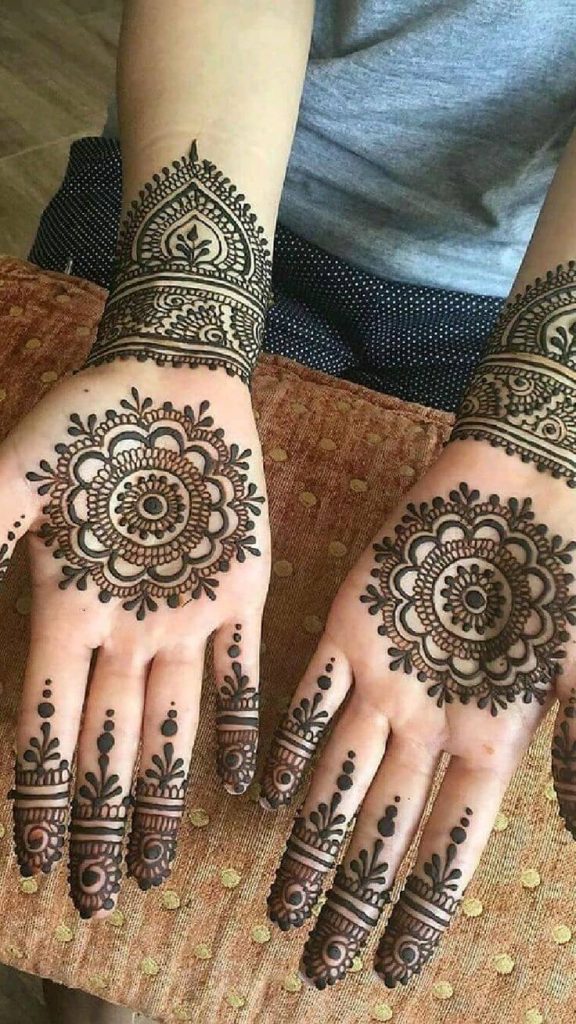 Intricate bridal palm mehndi design with elaborate floral, paisley, and traditional patterns.