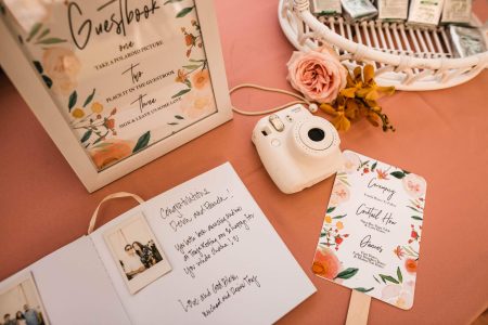 Creative wedding guest book ideas displayed on a table with decorative accents and guest messages.